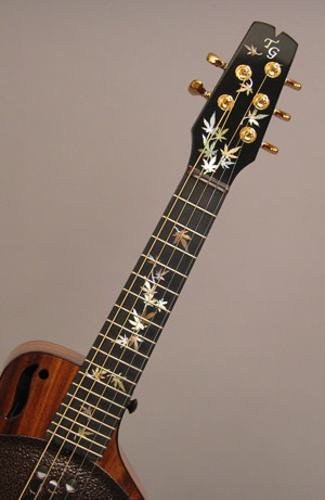 Picture of the Japanese maple leaf inlay on the neck and headstock