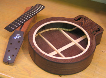 Photo of Mandonator 11 showing binding on the body, inlay on headstock, and fingerboard ready to install