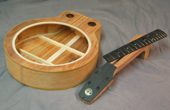 Photo of Mandonator 12 showing the body with binding, headstock with inlay, and fingerboard ready to install