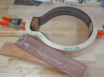 Photo showing early stages of neck blank, fingerboard, and rim of Mandonator 14