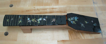Photo of the neck after glueing the fingerboard and head veneer for Mandonator 9